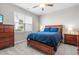 Comfortable bedroom featuring warm tones, ceiling fan, and natural light, creating a welcoming personal space at 3333 Jones Lake Rd, Fuquay Varina, NC 27526