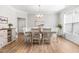 Bright dining room featuring a table set for six, natural light, and elegant decor at 3333 Jones Lake Rd, Fuquay Varina, NC 27526