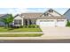 Inviting single-Gathering home featuring a well-maintained lawn, landscaping, and a convenient two-car garage at 3333 Jones Lake Rd, Fuquay Varina, NC 27526