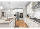 Modern kitchen with white cabinets, stainless steel appliances, granite countertops, and a functional layout at 3333 Jones Lake Rd, Fuquay Varina, NC 27526