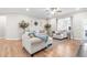 Spacious living room features neutral decor, with ample seating, creating an inviting area for relaxation and entertainment at 3333 Jones Lake Rd, Fuquay Varina, NC 27526