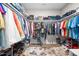 Organized walk-in closet with plentiful shelving, hanging rods, and compartments to maximize storage space at 3333 Jones Lake Rd, Fuquay Varina, NC 27526