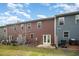 Spacious backyard with a concrete patio and well-maintained lawn, perfect for outdoor entertaining at 3403 Cardinal Lake Dr, Durham, NC 27704