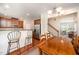 Open dining area featuring a breakfast bar and access to the staircase and living room at 3403 Cardinal Lake Dr, Durham, NC 27704