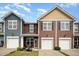 The townhomes feature a private entrance, front porch, and a well-maintained lawn at 3403 Cardinal Lake Dr, Durham, NC 27704
