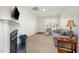 Cozy living room with a fireplace, natural light, and neutral decor at 3403 Cardinal Lake Dr, Durham, NC 27704