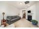 Bright living room with a cozy fireplace, neutral walls, and comfortable seating at 3403 Cardinal Lake Dr, Durham, NC 27704