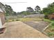 Spacious backyard with a mix of concrete and brick patios, a grassy area, and a wooden fence at 3610 Lambert Ln, Rocky Mount, NC 27804
