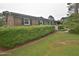 Quaint brick home with black shutters, well-maintained landscaping, and a welcoming front entrance at 3610 Lambert Ln, Rocky Mount, NC 27804