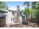 The backyard is enclosed by a wooden fence and includes a patio area, perfect for outdoor activities at 404 Shannonford Ct, Wake Forest, NC 27587