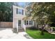 Charming two-story home boasts a well-manicured lawn and inviting front porch with green shutters at 404 Shannonford Ct, Wake Forest, NC 27587