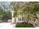 Charming two-story home boasts a well-manicured lawn and inviting front porch with green shutters at 404 Shannonford Ct, Wake Forest, NC 27587