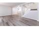 Open-concept living space with modern flooring and a staircase leading to the upper level at 404 Shannonford Ct, Wake Forest, NC 27587