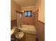 Modest bathroom featuring a combination tub and shower with linoleum flooring at 603 Pineland St, Sanford, NC 27330