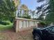Angle view of the brick home, showing blue shutters and a truck parked on the side at 603 Pineland St, Sanford, NC 27330