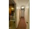 View down the hallway showing a kitchen and bedrooms at 603 Pineland St, Sanford, NC 27330