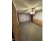 The living room has brick accent wall, carpeted floor, and access to natural light at 603 Pineland St, Sanford, NC 27330