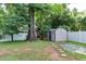 An expansive backyard is partially fenced in and features multiple storage sheds at 604 Mills St, Raleigh, NC 27608
