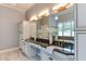Elegant bathroom features dual sinks, granite countertops, and decorative lighting at 604 Mills St, Raleigh, NC 27608