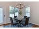 Cozy dining area with a glass table, seating for four, and a stylish chandelier at 604 Mills St, Raleigh, NC 27608