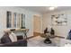 Comfortable living room with stylish decor, hardwood floors, and an open doorway to adjacent spaces at 604 Mills St, Raleigh, NC 27608