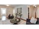 Well-decorated living room featuring hardwood floors, neutral walls, and an open staircase to the second floor at 604 Mills St, Raleigh, NC 27608