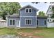 Rear exterior view of the house showcases the home's backyard at 604 Mills St, Raleigh, NC 27608
