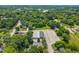 An aerial view of a home showing the surrounding neighborhood, mature trees, and overall community layout at 722 Baker St, Oxford, NC 27565