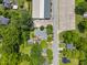 Overhead view showing the layout of a brick home, patio, landscaping, and its surrounding neighborhood at 722 Baker St, Oxford, NC 27565
