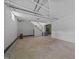 Unfinished basement features concrete floors and block walls with open staircase leading to the upper level of the home at 722 Baker St, Oxford, NC 27565
