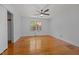 Bright bedroom featuring hardwood floors, a ceiling fan, and a window offering pleasant views at 722 Baker St, Oxford, NC 27565