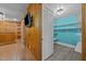 Spacious bonus room with rustic wood paneling, tile flooring, and a brightly painted adjacent walk-in closet at 722 Baker St, Oxford, NC 27565