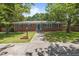 Charming brick home with blue shutters, lush green lawn, and mature trees creating a welcoming curb appeal at 722 Baker St, Oxford, NC 27565