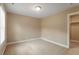 Neutral bedroom featuring plush carpet, overhead lighting and a closet at 724 Piermont Dr, Cary, NC 27519