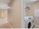 Upstairs laundry room with appliances and convenient shelf storage at 724 Piermont Dr, Cary, NC 27519