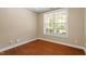 Bright home office featuring hardwood floors, a window view, and neutral walls at 724 Piermont Dr, Cary, NC 27519