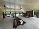 A covered picnic area features ceiling fans, stone pillars, and a fireplace at 724 Piermont Dr, Cary, NC 27519