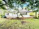 Charming vintage home with a covered front porch with brick trim and lovely landscaping at 747 Buckhorn Rd, Sanford, NC 27330