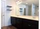 Spacious bathroom with double vanity, dark cabinets, and modern fixtures at 820 Houston Ct, Haw River, NC 27258