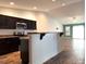 Bright kitchen showcases dark cabinets, stainless steel appliances, and an open layout at 820 Houston Ct, Haw River, NC 27258