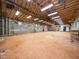 Large, unfinished basement with exposed ceiling beams and concrete walls offering space for customization at 8917 Thompson Mill Rd, Wake Forest, NC 27587