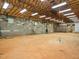 Unfinished basement with exposed beams, concrete walls, and large open area, ideal for customization at 8917 Thompson Mill Rd, Wake Forest, NC 27587