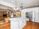 Modern kitchen featuring stainless steel appliances, a granite island, and an open layout at 8917 Thompson Mill Rd, Wake Forest, NC 27587