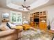 Relaxing living room with French doors, a ceiling fan, and a built-in entertainment center at 8917 Thompson Mill Rd, Wake Forest, NC 27587
