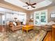 Cozy living room with hardwood floors, comfortable seating, and a view into the modern kitchen at 8917 Thompson Mill Rd, Wake Forest, NC 27587