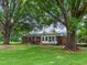 Brick ranch-style home with large backyard and mature trees at 9455 Boston Rd, Roxboro, NC 27574