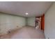 This basement bedroom has painted walls and tile floors at 9455 Boston Rd, Roxboro, NC 27574