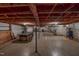 This basement has exposed ceilings, a pool table, and a stairway at 9455 Boston Rd, Roxboro, NC 27574