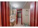 This bathroom has a single sink and a shower with tiling and wood trim at 9455 Boston Rd, Roxboro, NC 27574