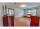 Bedroom with two windows and hardwood floors at 9455 Boston Rd, Roxboro, NC 27574